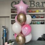 Foil balloons and bouquet of latex helium balloons