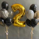 Set of gold and black balloons for him