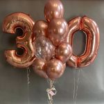 Bouquet of balloons with confetti and rose gold chrome