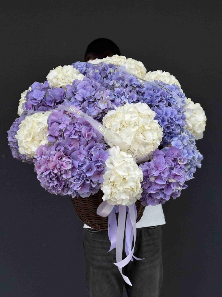 Basket of lavender and white hydrangeas