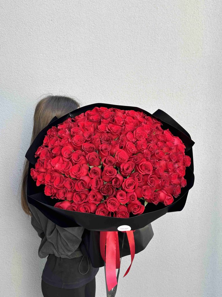 Bouquet of red roses in black packaging