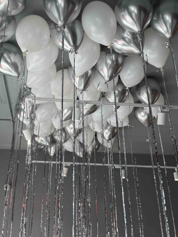 Silver and white latex balloons